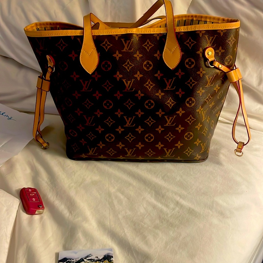 Louis Vuitton never full bag no stains almost new asking 3200 or best offer